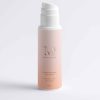Flacon de l'Exfoliant Peau Neuve Éclat Unifiant Mimiastou-Glow-Skin sur fond blanc pour le visage et le corps